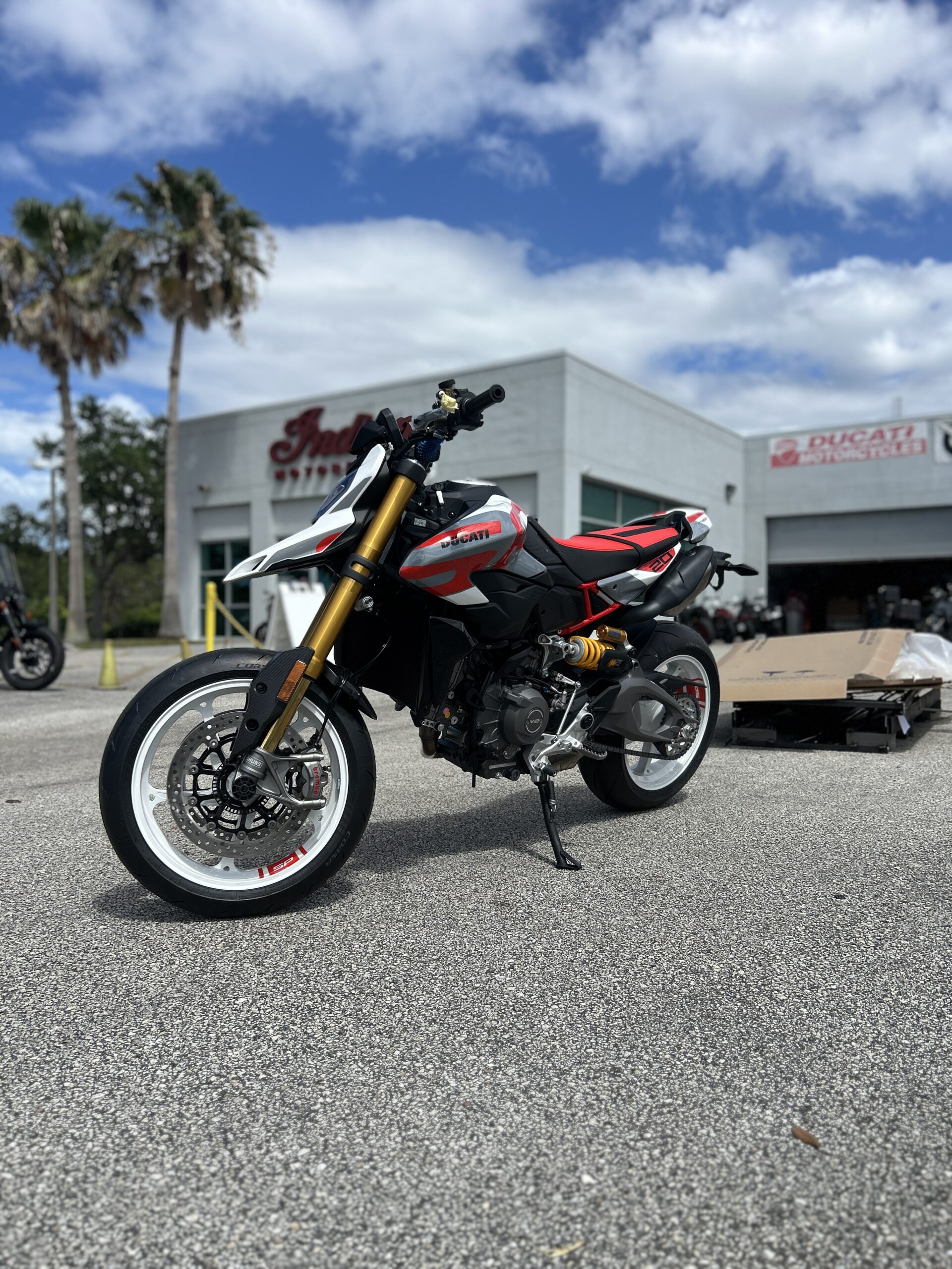 2026 Ducati Hypermotard V2 SP parked outside Power Motorcycles USA in Palm Bay Florida featuring premium Ohlins suspension, supermoto styling, and Ducati performance upgrades
